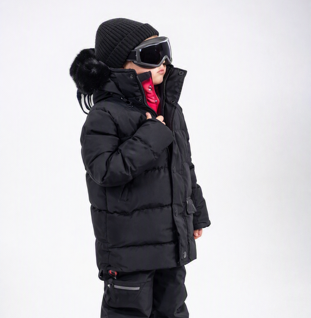 Rafa's Luxury Snowsuit, an OSNO one-piece boys snowsuit with removable fur trim, sold exclusively at JuniorKids stores online