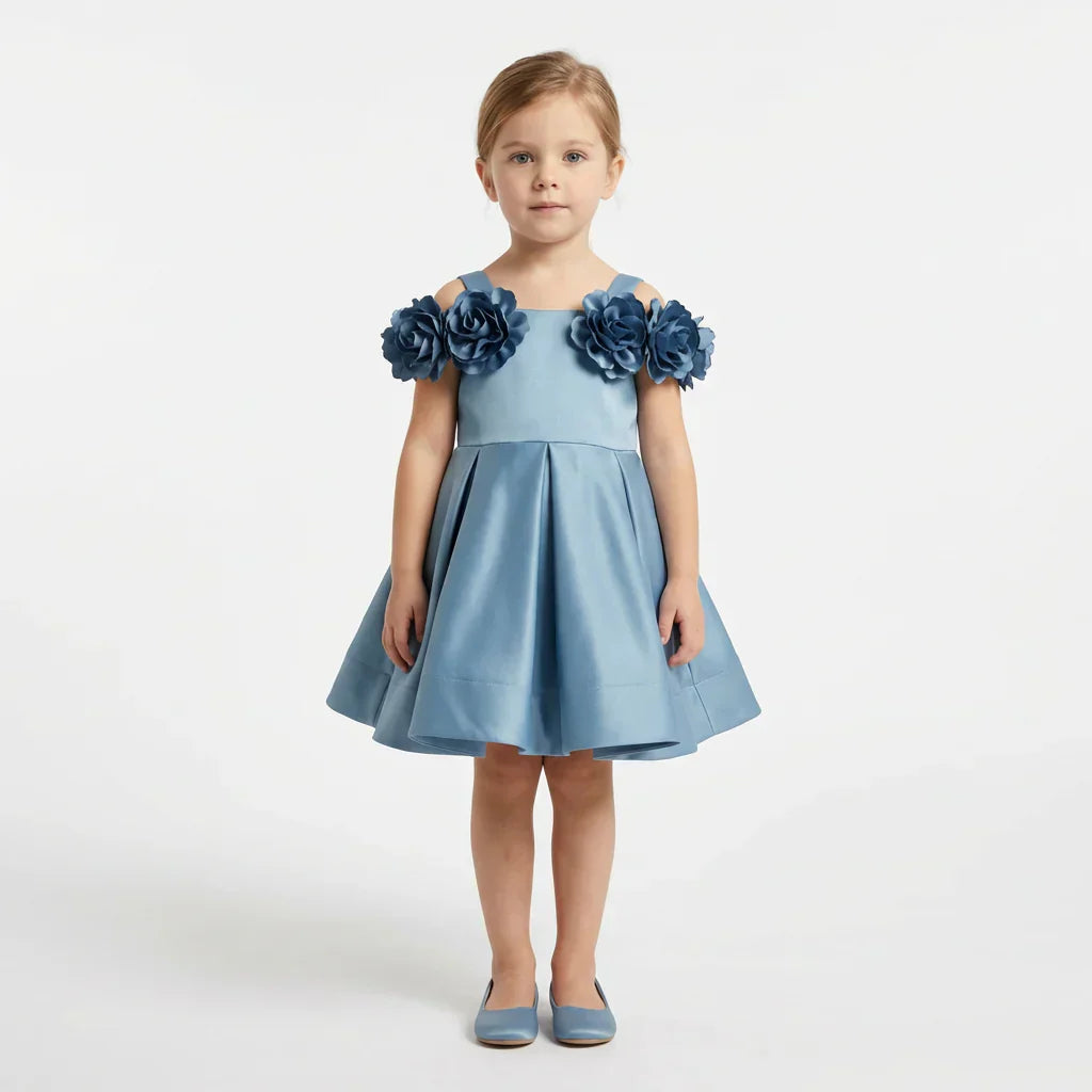 JuniorKids steel blue satin A-line flower girl dress with 3D rose shoulder detail and pleated full skirt