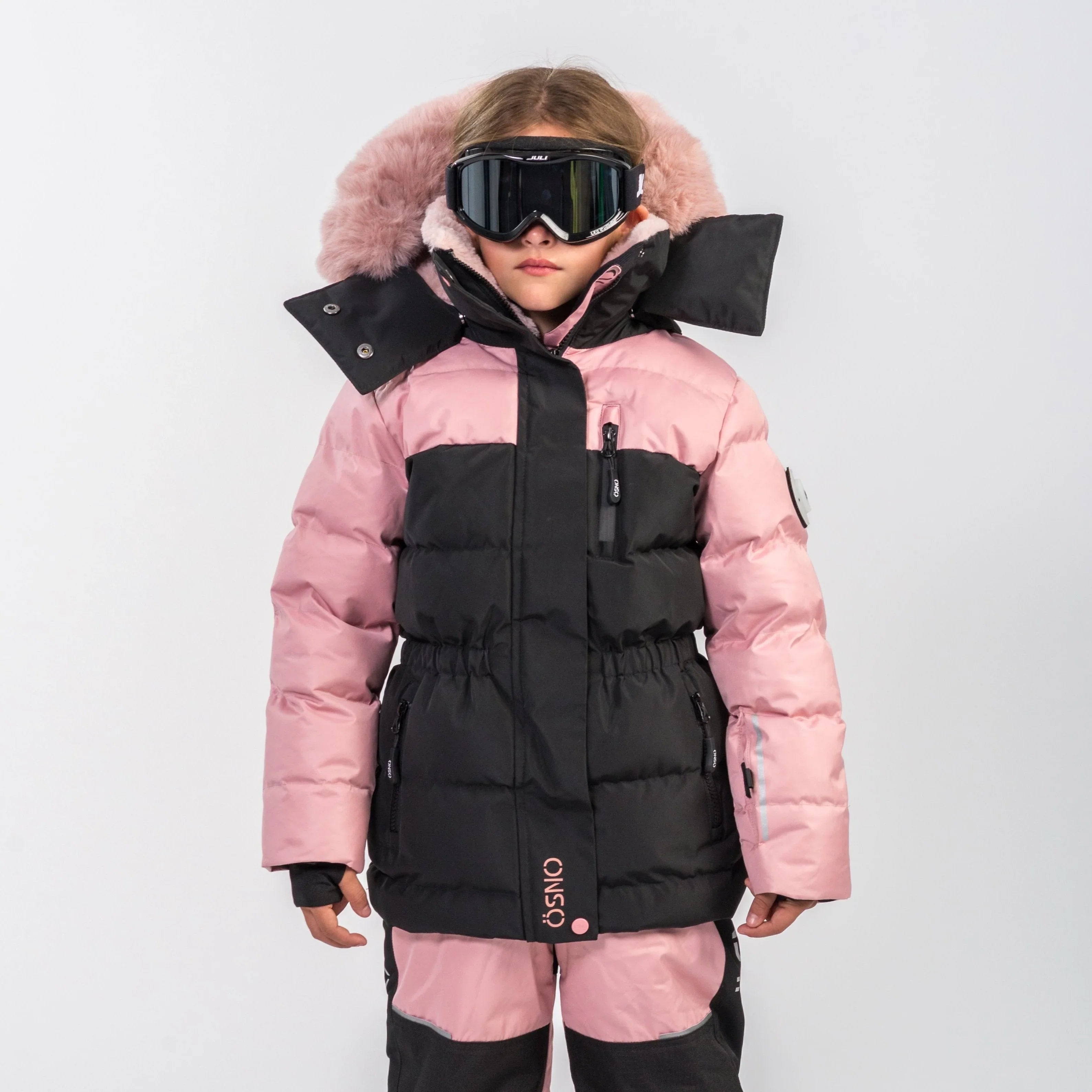 Angel's Luxury Snowsuit, an OSNO one-piece girls snowsuit style in blush with fur trim, sold exclusively at JuniorKids store.