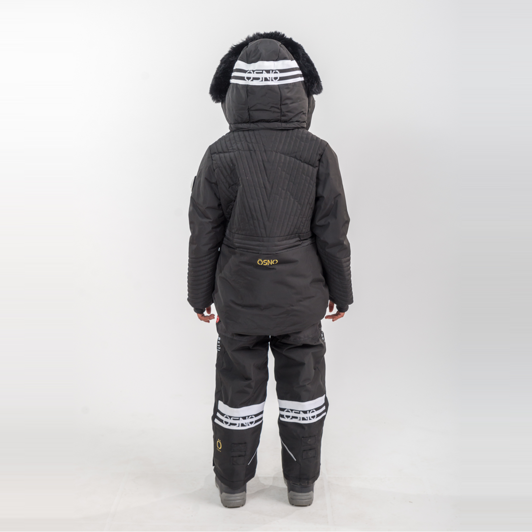 Person wearing a black snowsuit with white stripes on a white background